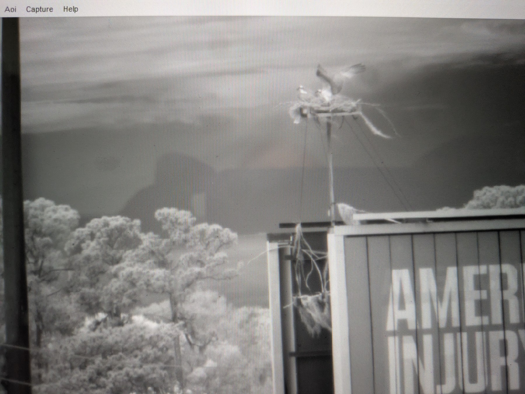 Thermal view of an aircraft above buildings